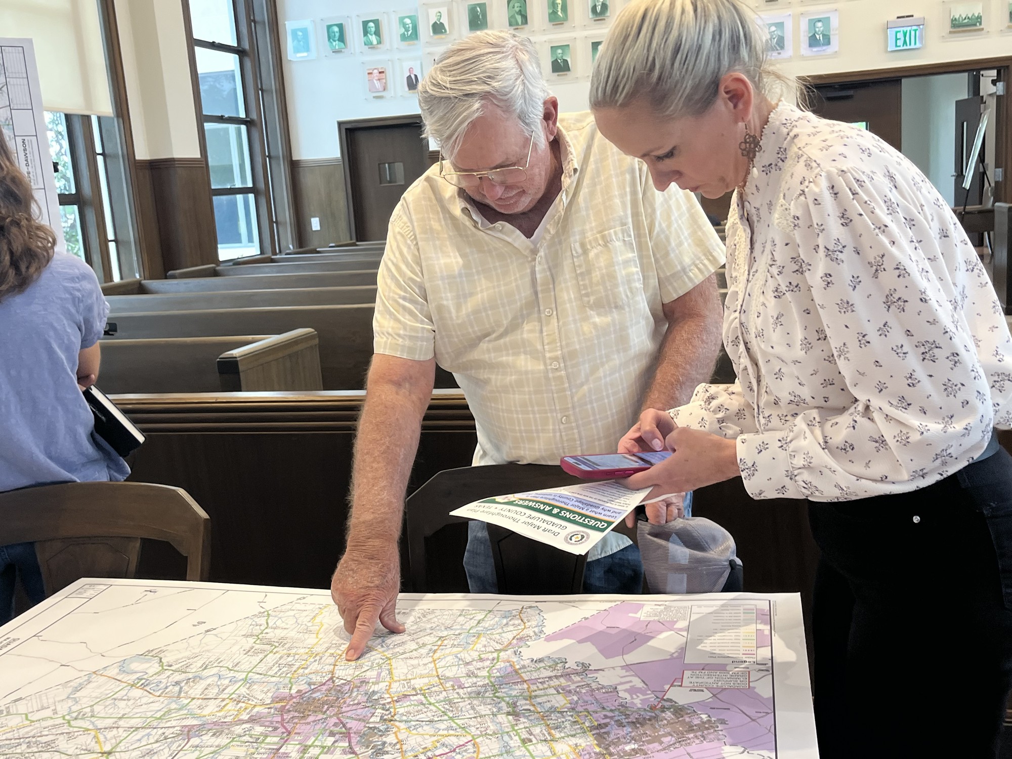 Resident and county staff discuss draft major thoroughfare plan at public meeting.